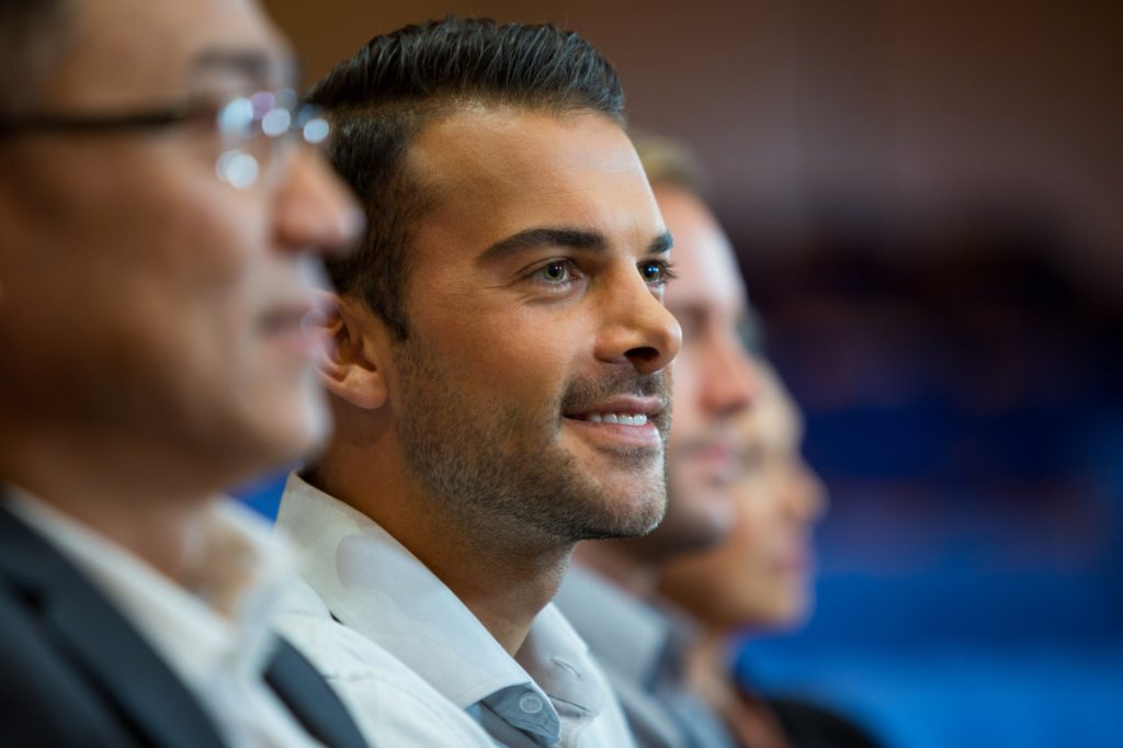 Business executives listening to speech